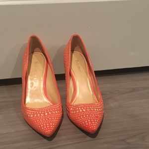 Enzo Angiolini orange heels.